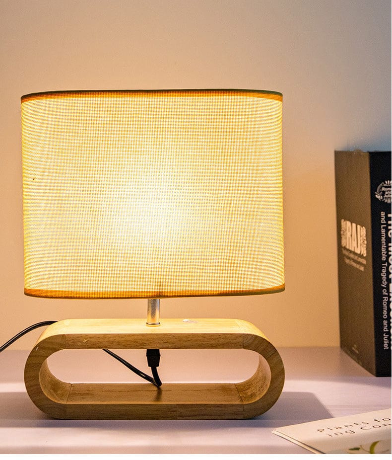 ZenGlow – Minimalistische ovale Tischlampe mit Holzstoßbasenjọ