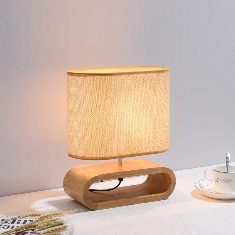 ZenGlow – Minimalistische ovale Tischlampe mit Holzstoßbasenjọ