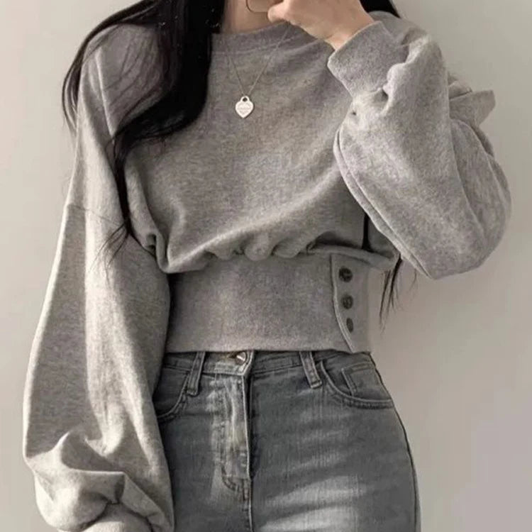 Luisa – Sudadera relajada con cinturón y detalle de botón