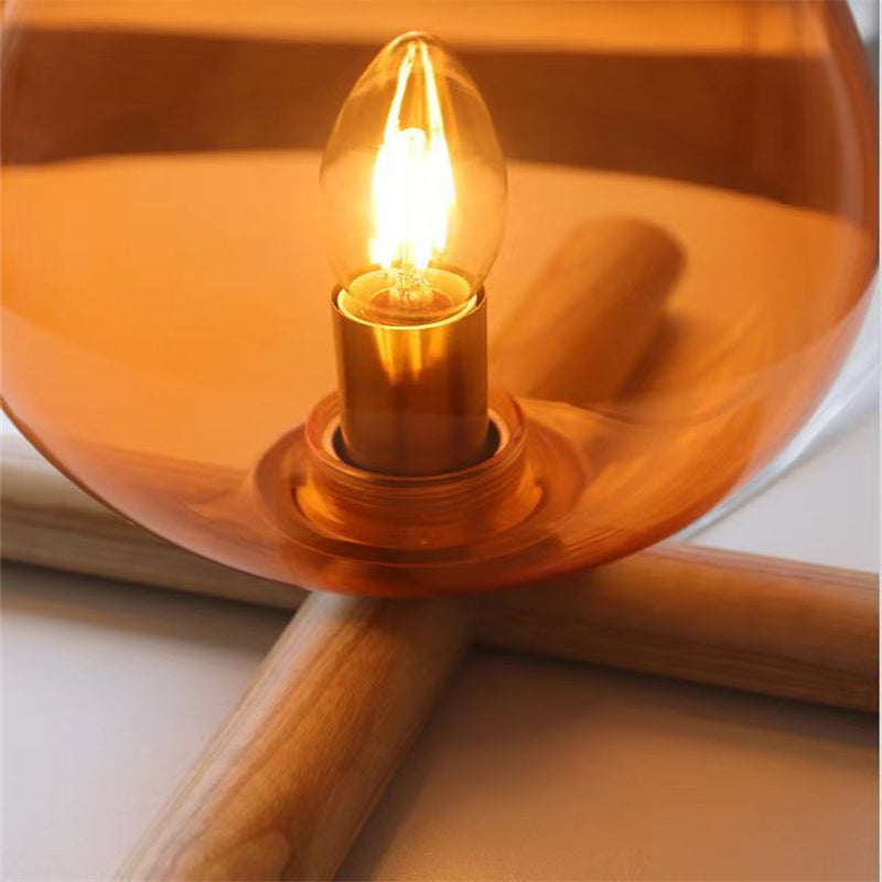 LumiAmber - Tropfenförmige Glas-Tischlampe mit Holzfuß