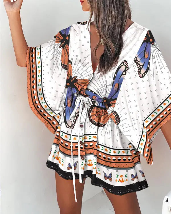 Naia - Afslappet minikjole med sommerfugleprint