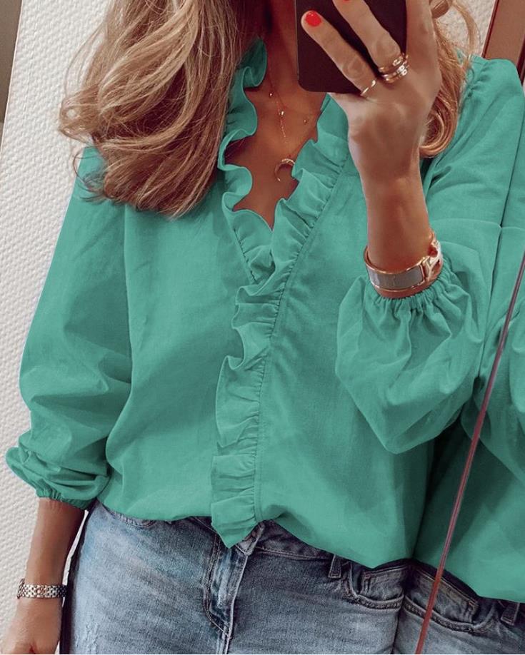 Lisa - Blusa con escote en V y volantes