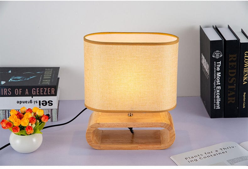 ZenGlow – Minimalistische ovale Tischlampe mit Holzstoßbasenjọ